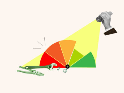 Flashlight shining on credit score gauge being repaired, symbolizing whether credit repair works or not