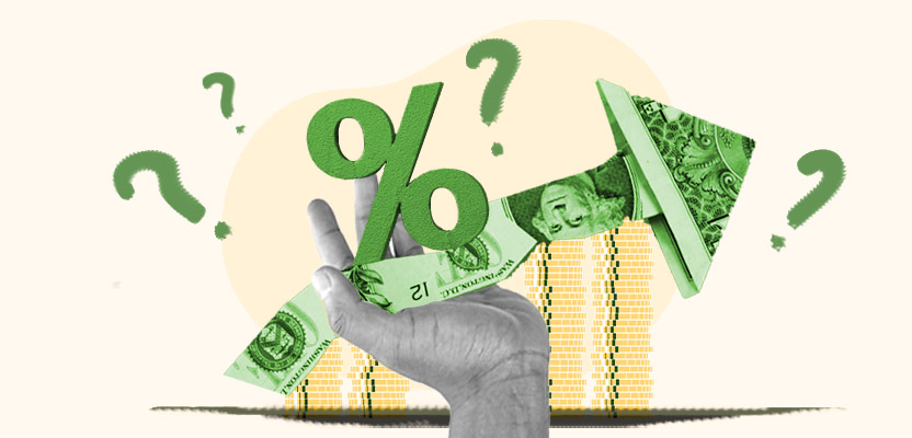 Hand holding a percentage sign symbolizing interest rate