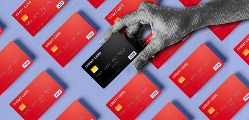 Hand grabbing the best credit card of many credit cards for bad credit