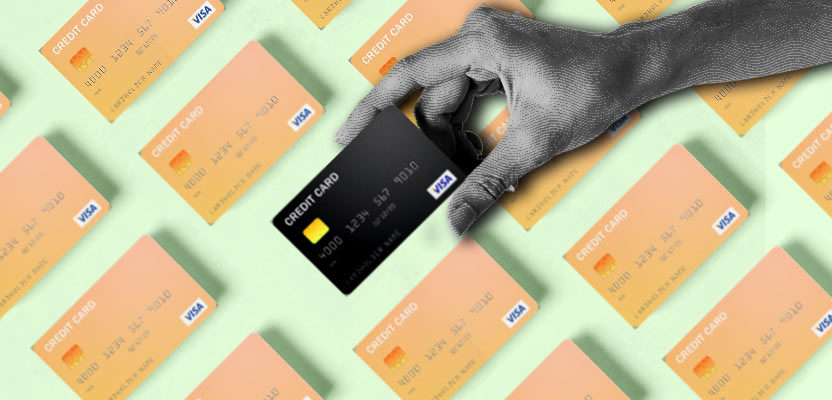 Hand grabbing the best credit card of many credit cards for no credit