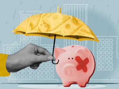 Umbrella over piggy bank representing a hardship program