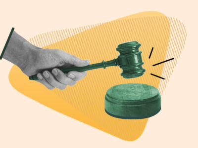 Hand pounding gavel representing a court judgment