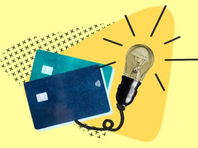 Lightbulb attached to credit card representing clever credit hack