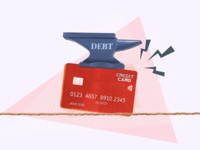 Anvil crushing credit card representing too much debt