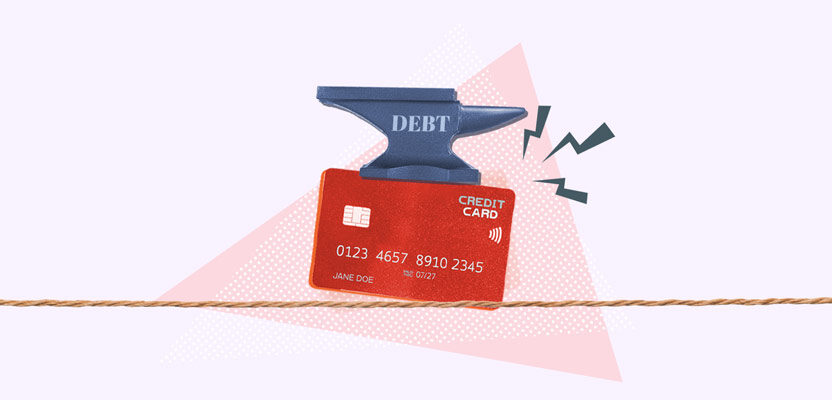 Anvil crushing credit card representing too much debt