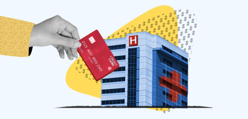 Card being inserted into hospital representing paying medical bills with a credit card