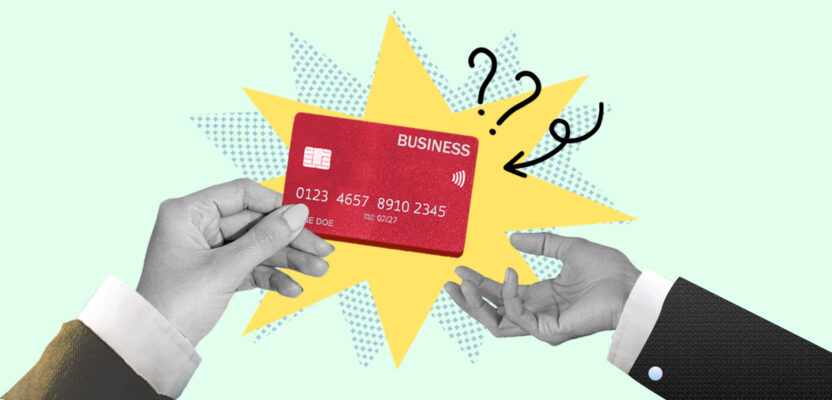 Hand receiving a business credit card