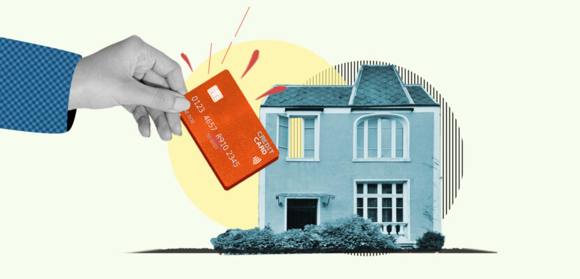 Credit card being inserted into house representing paying rent with a card