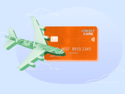 Credit card next to an airplane representing credit card miles