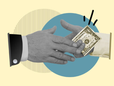 Hands exchanging money representing negotiating with debt collectors