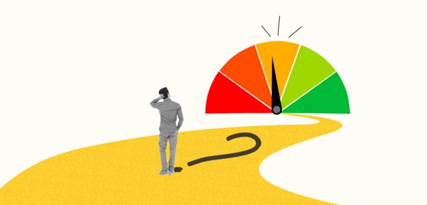 Man staring a credit score gauge showing a fair credit score