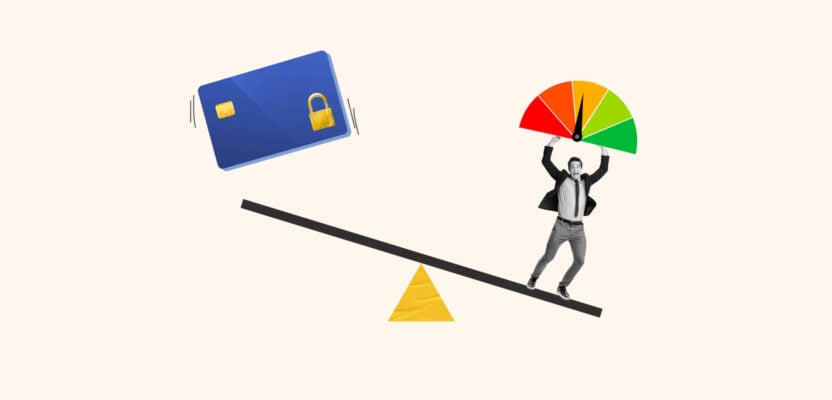 Secured credit card and credit score gauge on a scale representing raising your credit score