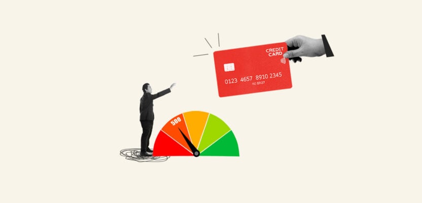 man with 500 credit score reaching for a credit card