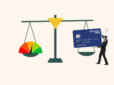 Business credit card and credit score gauge on a scale