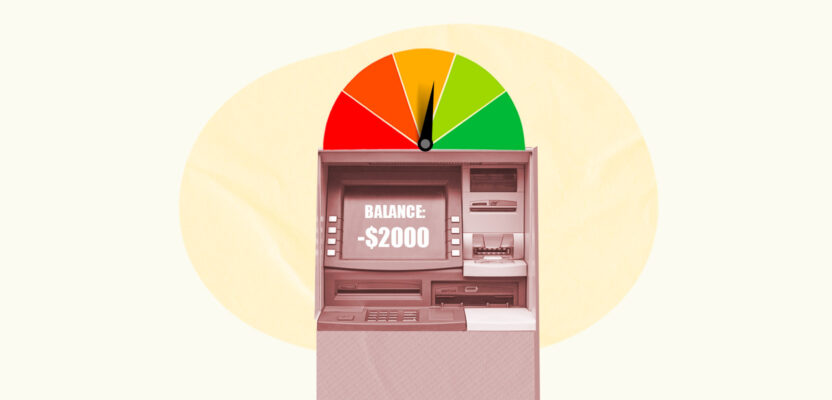 Credit score gauge behind ATM showing an overdraft message